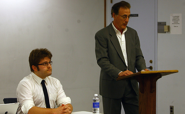 Gary Hull (right), director of the Duke Program on Values and Ethics in the Marketplace, introduces a panel of experts at a talk about clean energy Wednesday.