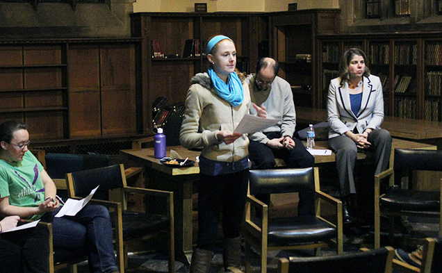 Freshman Gayle Powell, a member of Team Kenan, introduces a panel of administrators at a discussion about social groups’ selection processes Thursday night.
