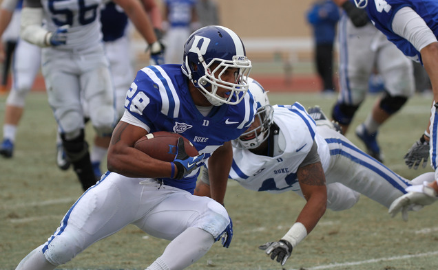 Running back Shaquille Powell sealed the victory for the Blue squad by breaking away from the pack for a fourth-quarter touchdown.