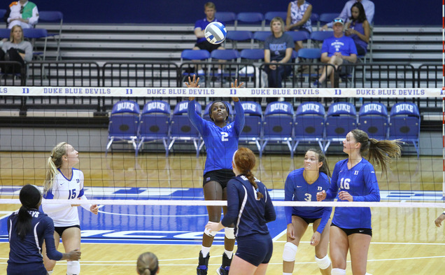 Senior Jeme Obeime, left, garnered all-tournament team accolades for her 49 kills in three games at the Duke Invitational.