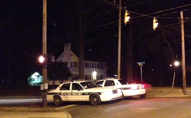 Two cop cars block off the entrance to Anderson Street from Campus Drive.