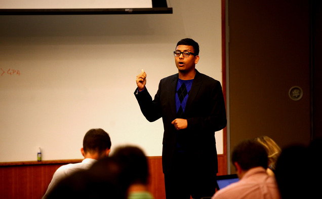 Executive Vice President Abhi Sanka presents on a resolution to create a research unit to help solve campus issues.