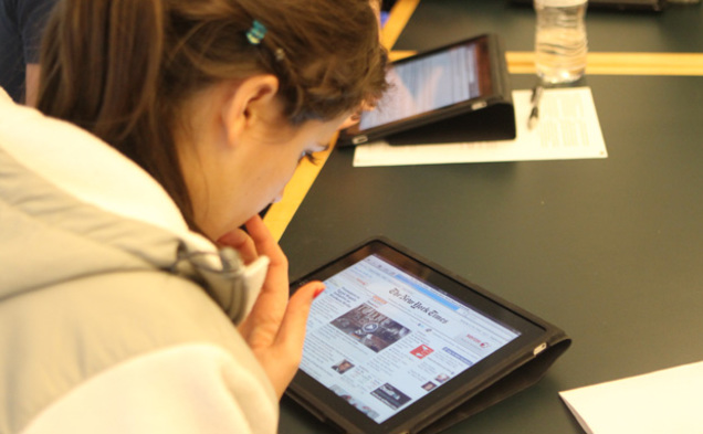 Richard Lucic, associate chair of the computer science department, has his students use iPads to learn the process of application development.