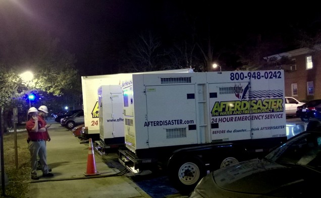 A team of workers from AFTERDISASTER emergency service are working to correct smoke an water damage in Brown residence hall.