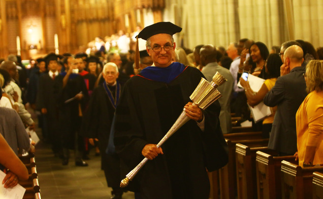 Joshua Socolar, chair of Academic Council, walks away from the alter after the Founders' Day convocation.